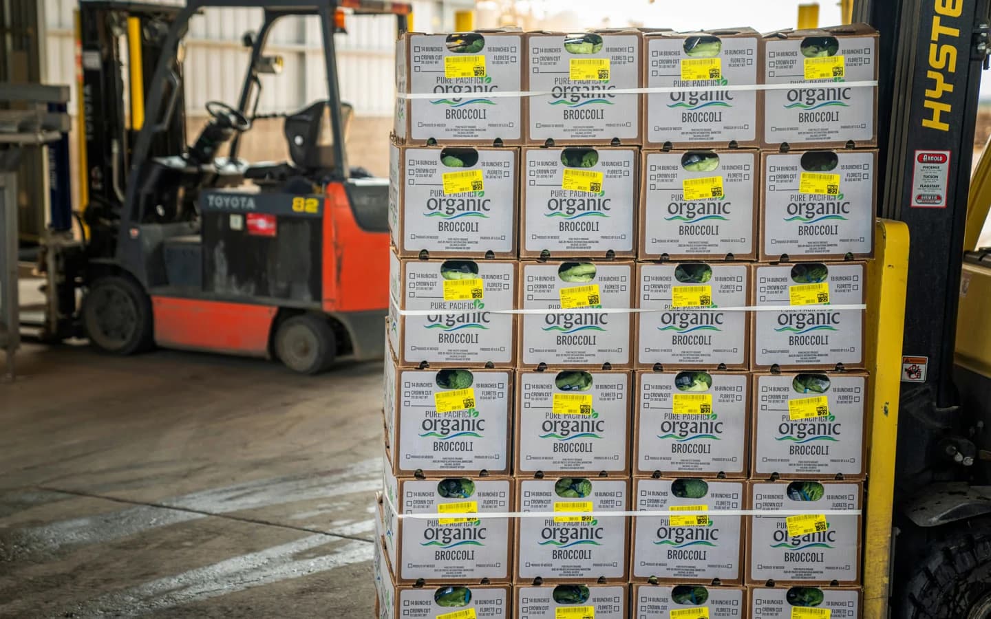 Forklift moving palletized fresh goods