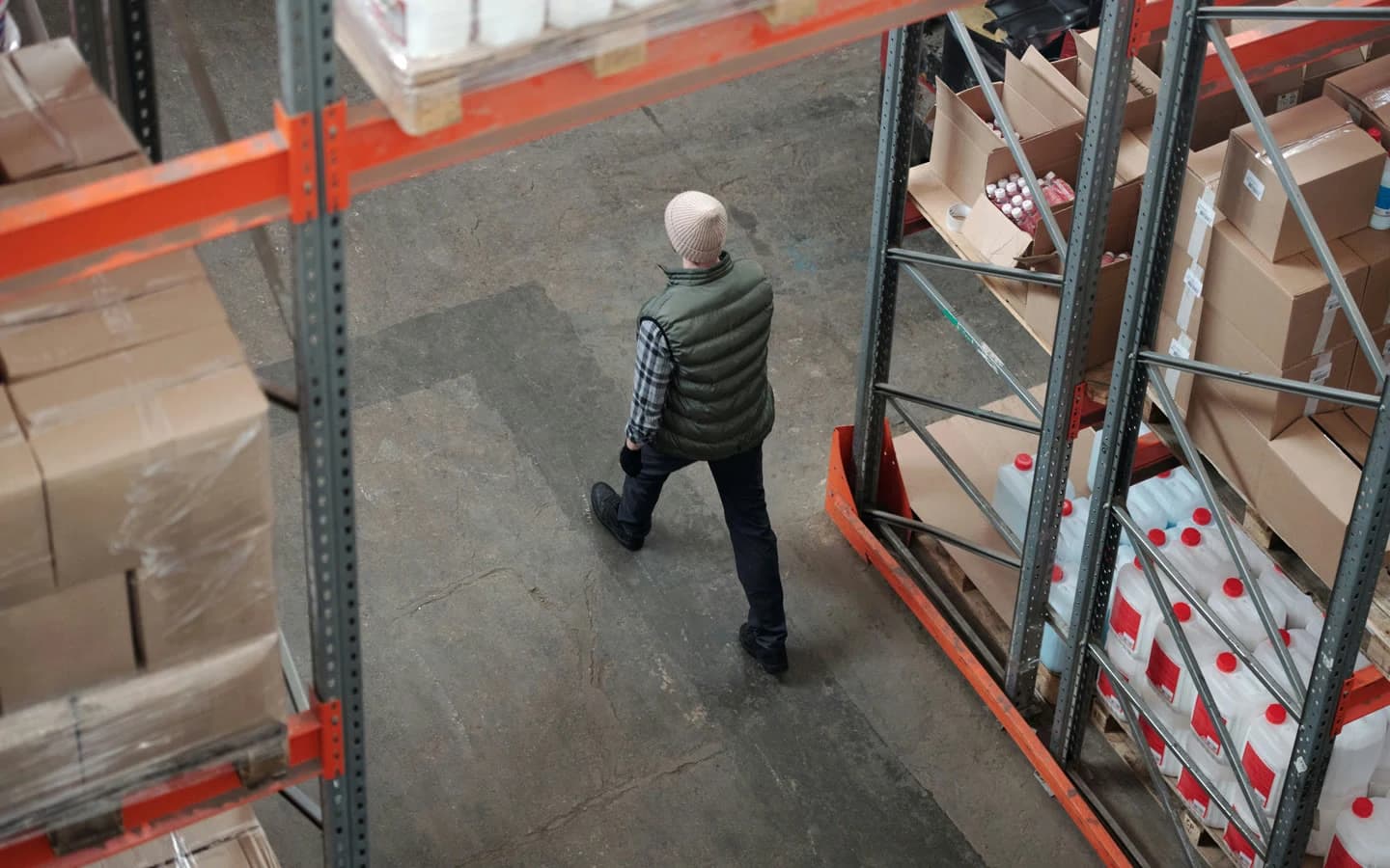 Warehouse team working between storage racks